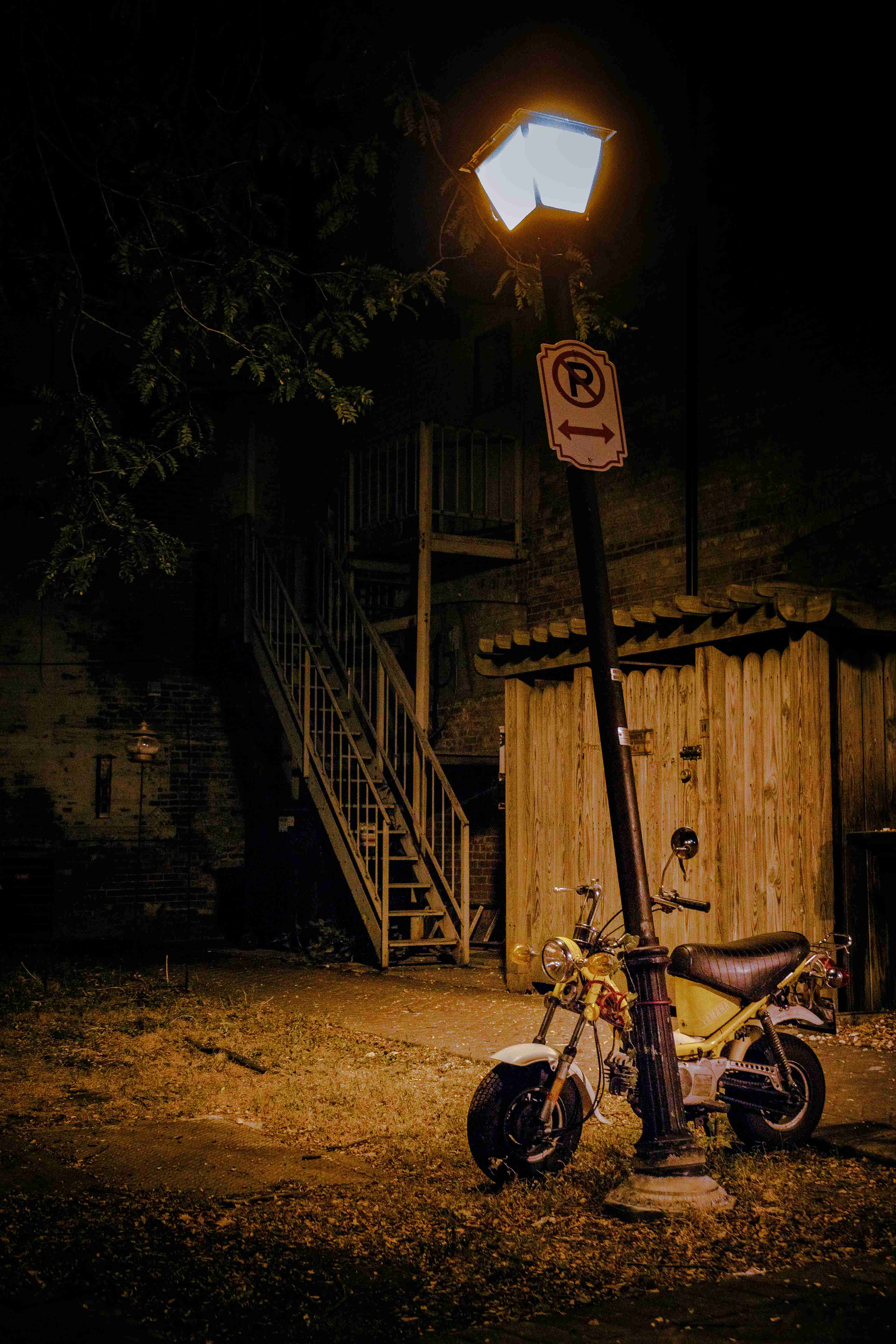 Motocycle under Sodium-vapor street lamp. — Bethlehem, PA.